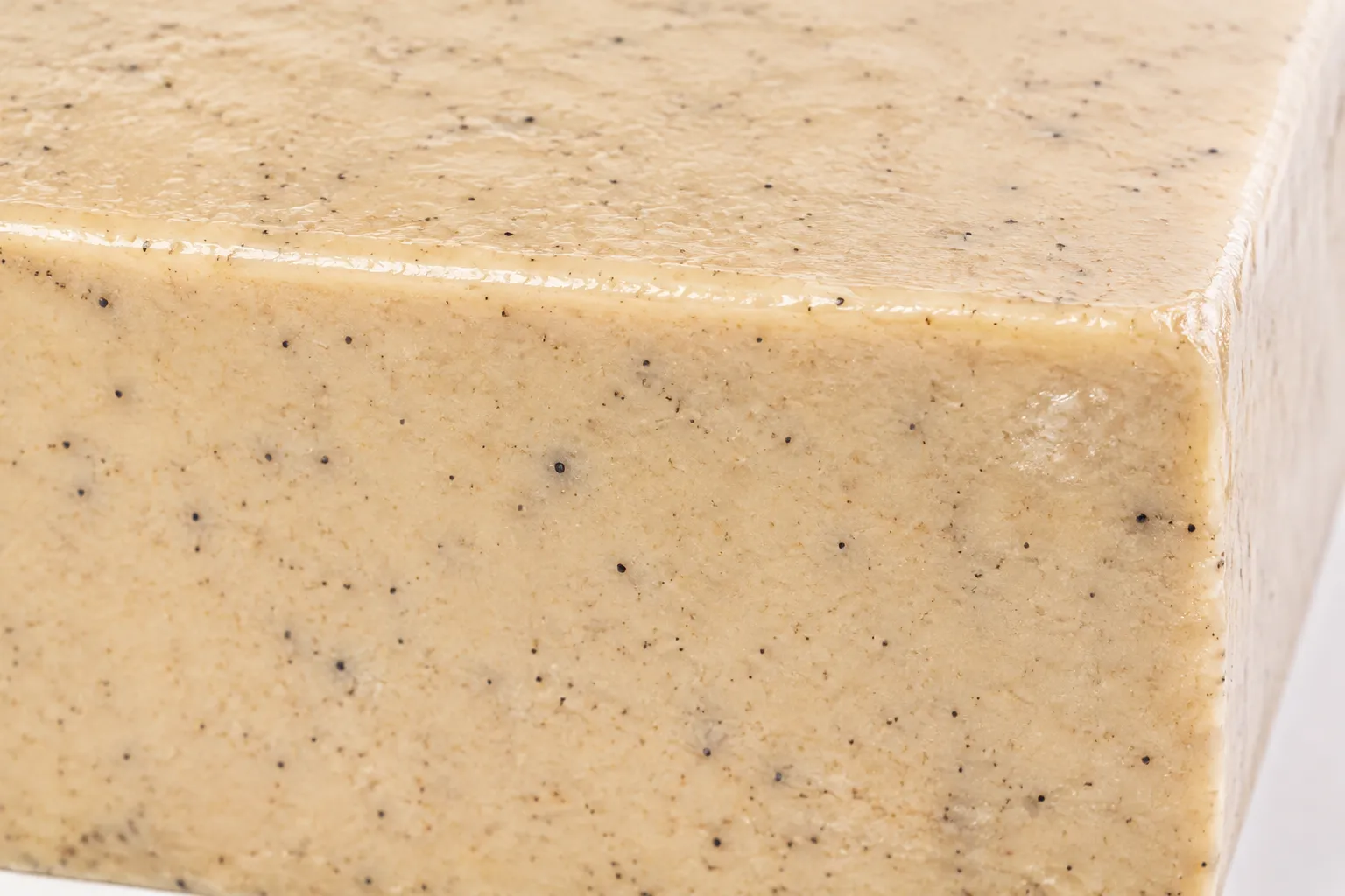 Close-up of the cut face of goma-dofu showing the dense smooth ivory interior