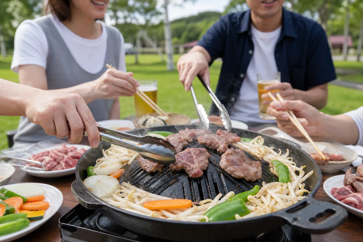 Jingisukan being grilled on the domed iron pan outdoors in Hokkaido