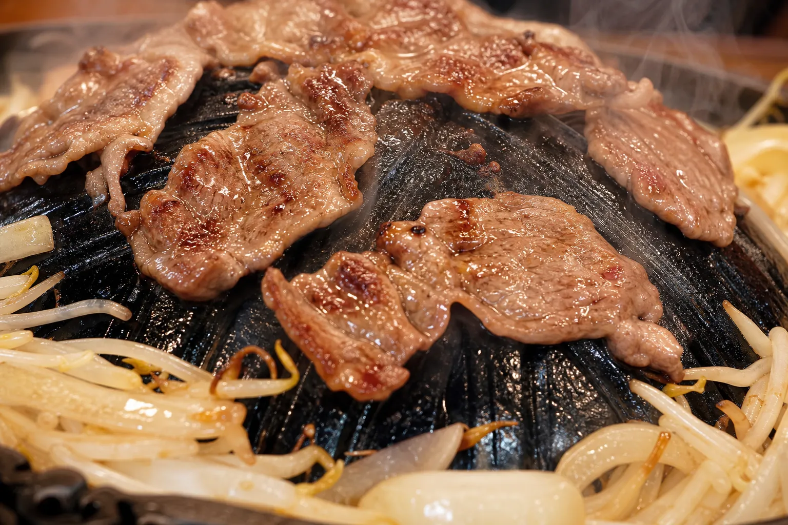 Close-up of grilled lamb with charred edges and tender center