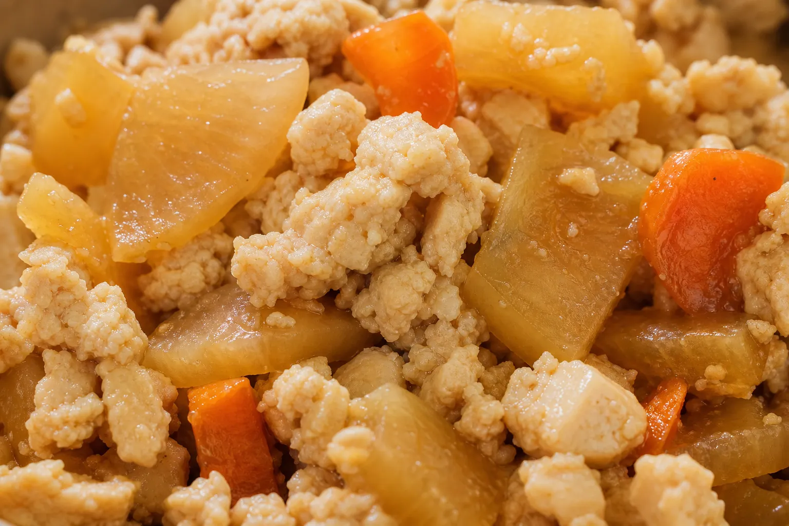 Close-up of crumbled tofu with daikon and carrot in kenchou