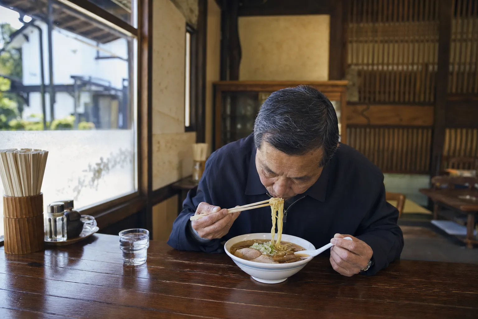 A local eating Kitakata ramen for breakfast in an old kura-town shop