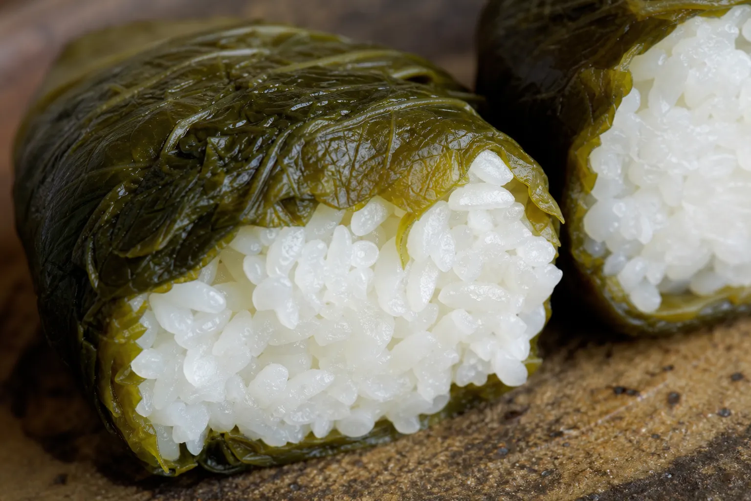 Close-up of mehari-zushi showing the pickled takana leaf wrapper
