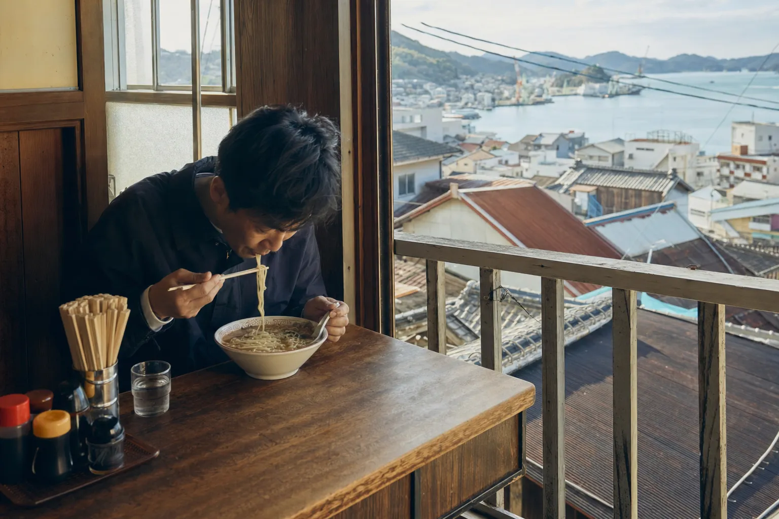 Onomichi ramen at a small shop with the seaside town visible