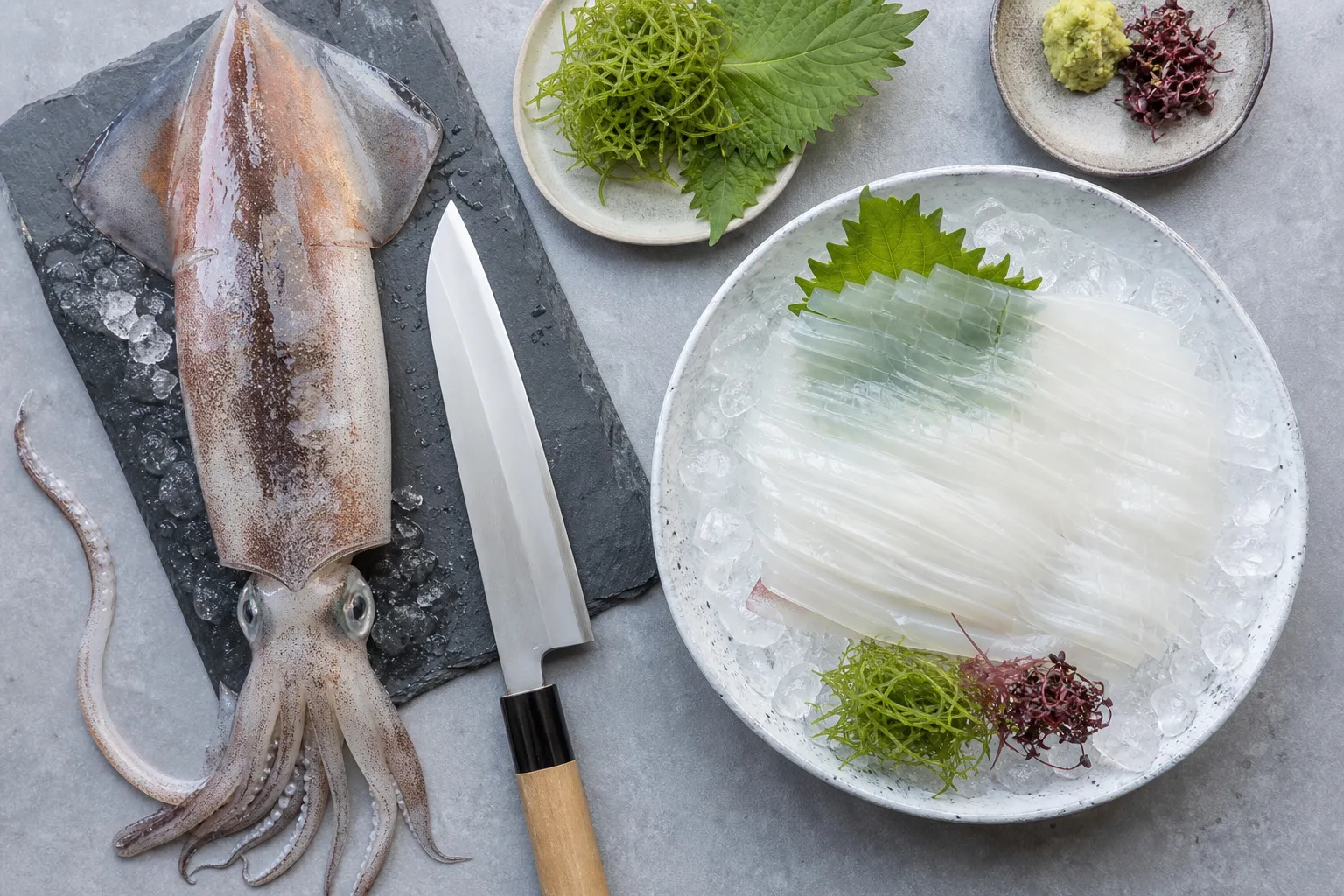 Preparing live squid ikizukuri at a Yobuko restaurant